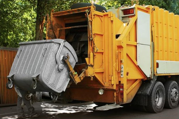 Collection truck emptying a waste container